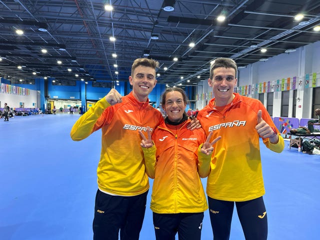 group of athletes in spain team uniforms in a sports venue