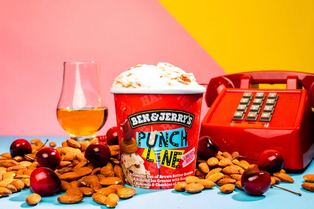 ben  jerry's punch line flavor in pint carton surrounded by almonds, cherries, bourbon, and a telephone