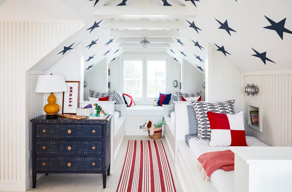 guest bedroom with white beach house bunks with blue stars on ceiling