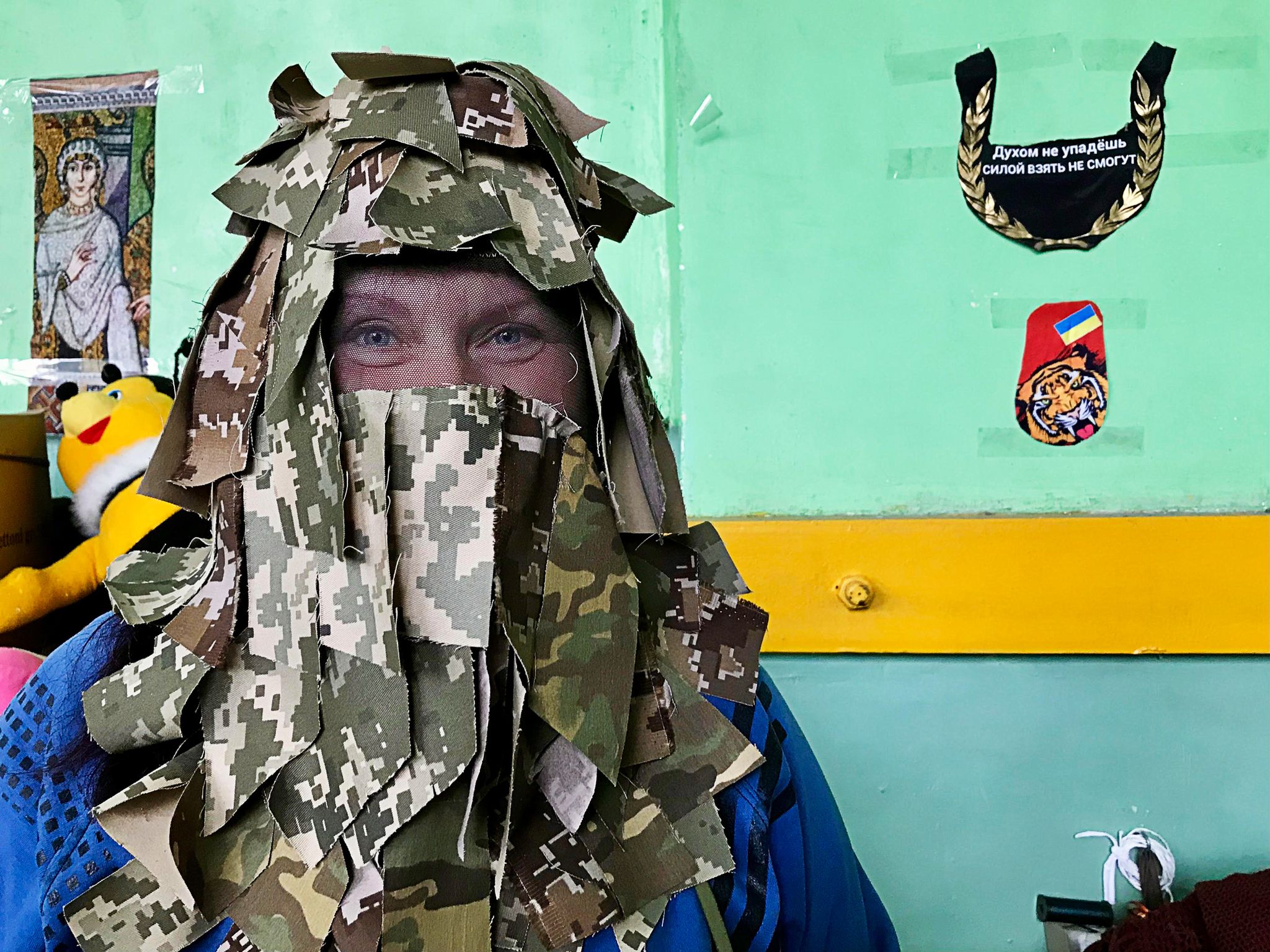 local and international volunteers support the resistance against the russian military in ukraine a volunteer in mykolaiv demonstrates her homemade ghillie hood