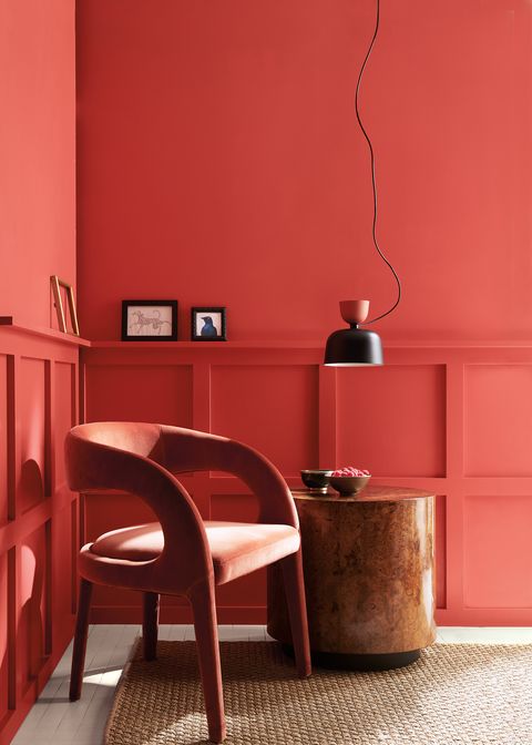 chair with raspberry blush on the wall