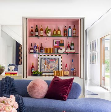 living room with home bar in pink