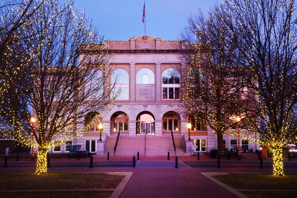 Bentonville Courthouse at Christmas a building with a flag on top