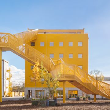 a yellow building with stairs