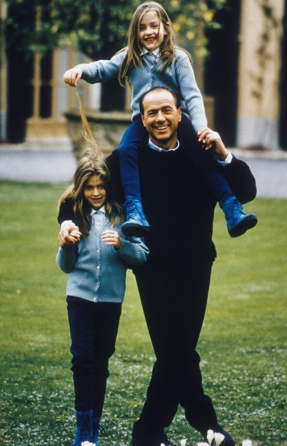 milan, italy january 01 a young silvio berlusconi in the garden of his villa near milan, with his daughters barbara l and eleonora whom he had from his second wife veronica lario in 1994 ca in milan, italy photo by franco origliagetty images