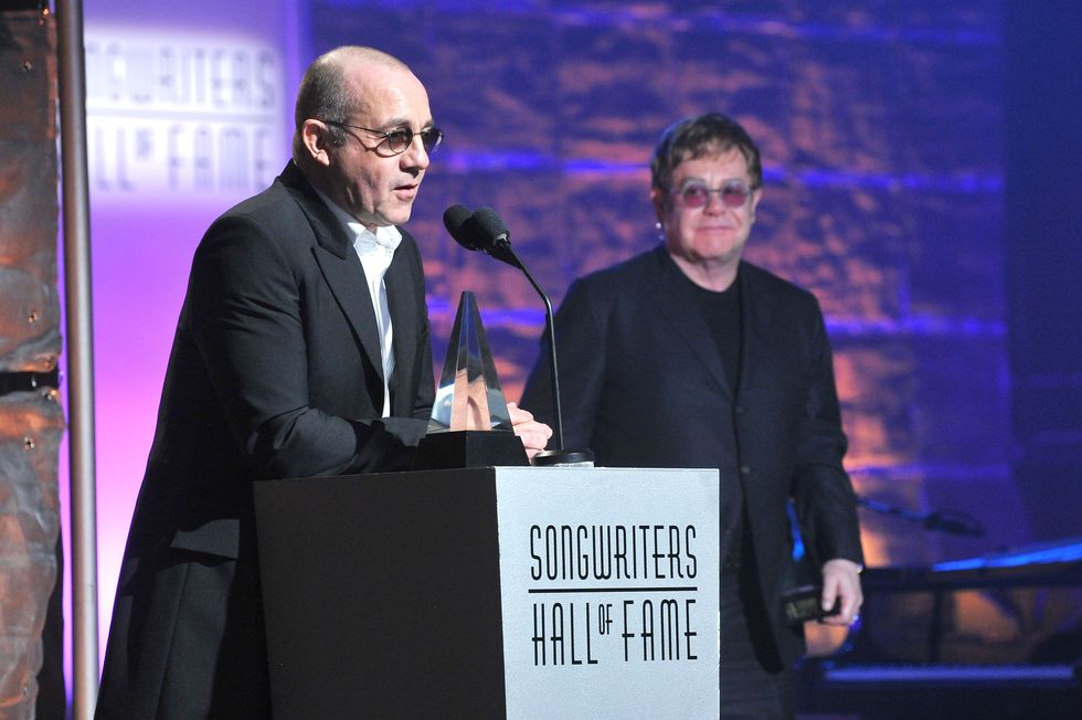 Bernie Taupin and Elton John accept the Mercer Award at the Songwriters Hall of Fame 44th Annual