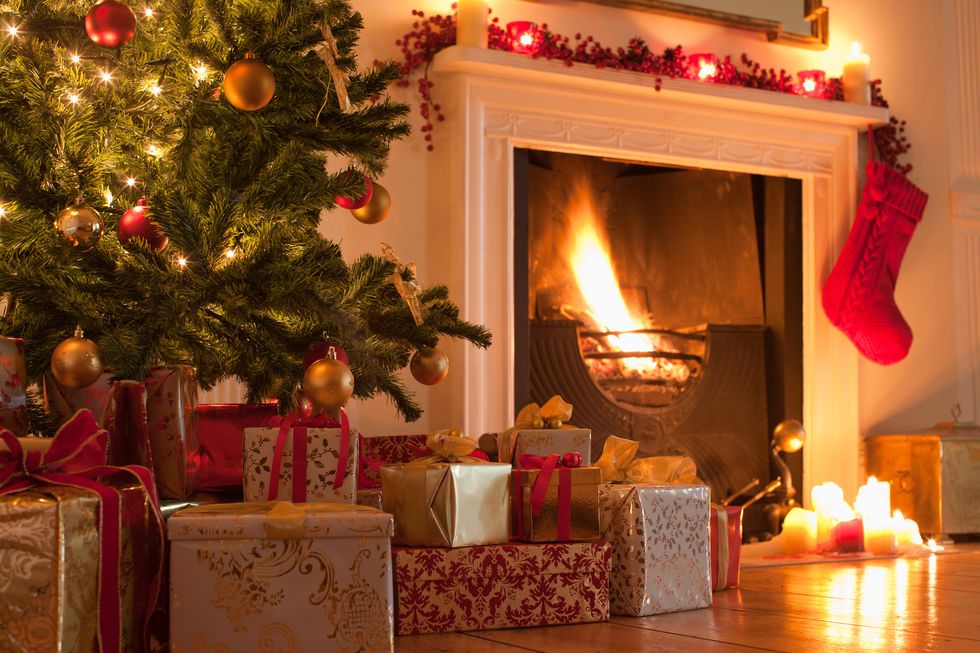 christmas tree and stocking near fireplace