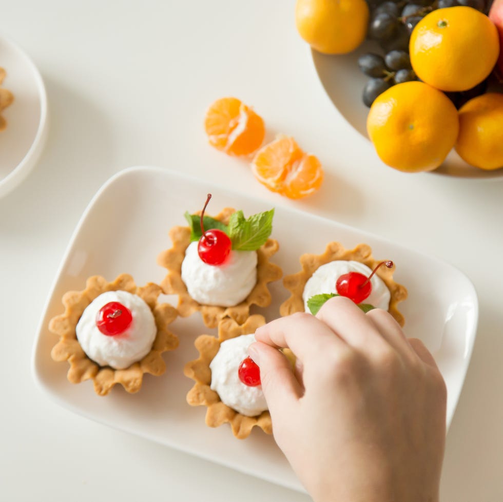 Berry tartlets served at the dinner table Berry tartlets served at the dinner table