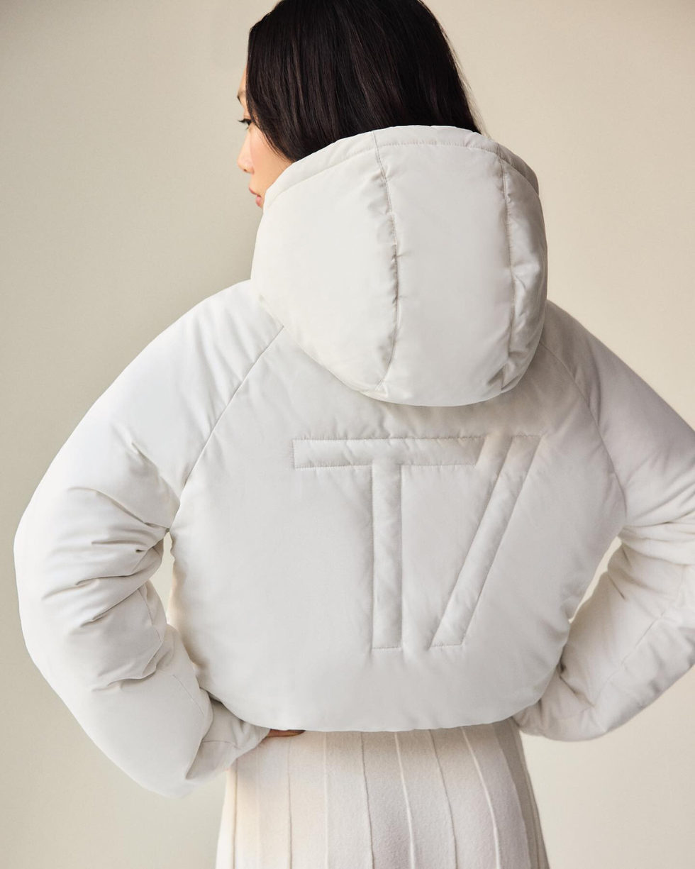 winter jacket with a hood and a tv logo on the back