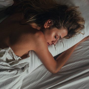 a person lying on a bed a person lying on a bed