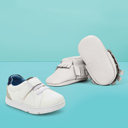 a pair of freshly picked baby moccasins, good housekeeping's pick for best moccasins, and a single carter's unisex first walker, good housekeeping's pick for best value walking shoe