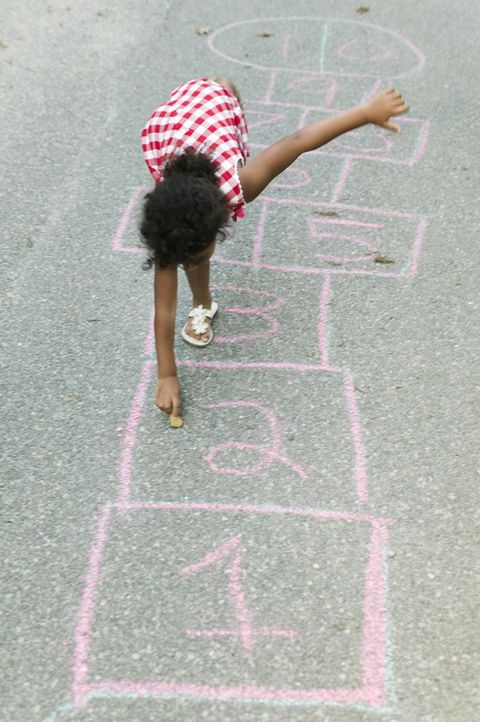 black girl playing hopscotch