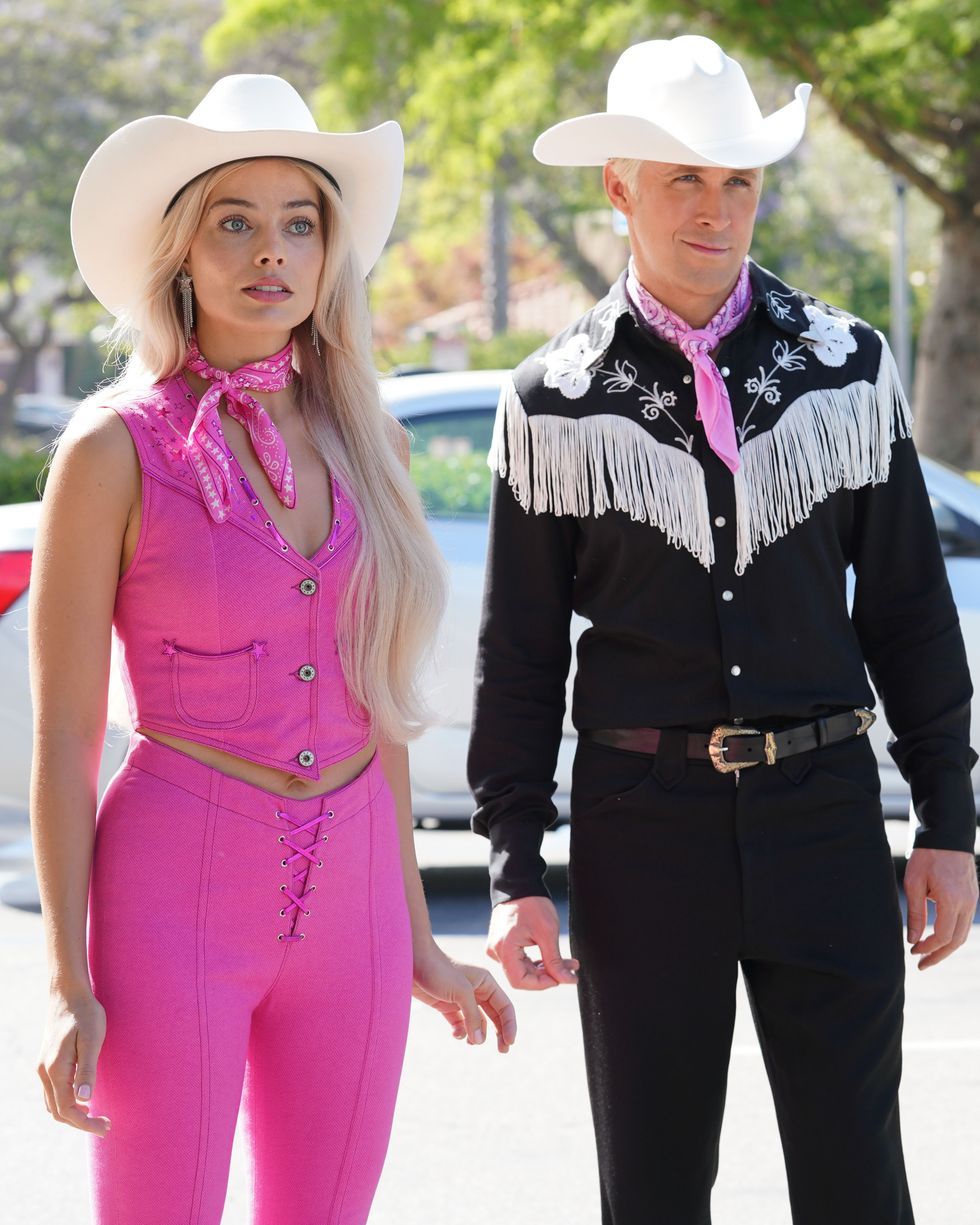a man and woman wearing cowboy hats