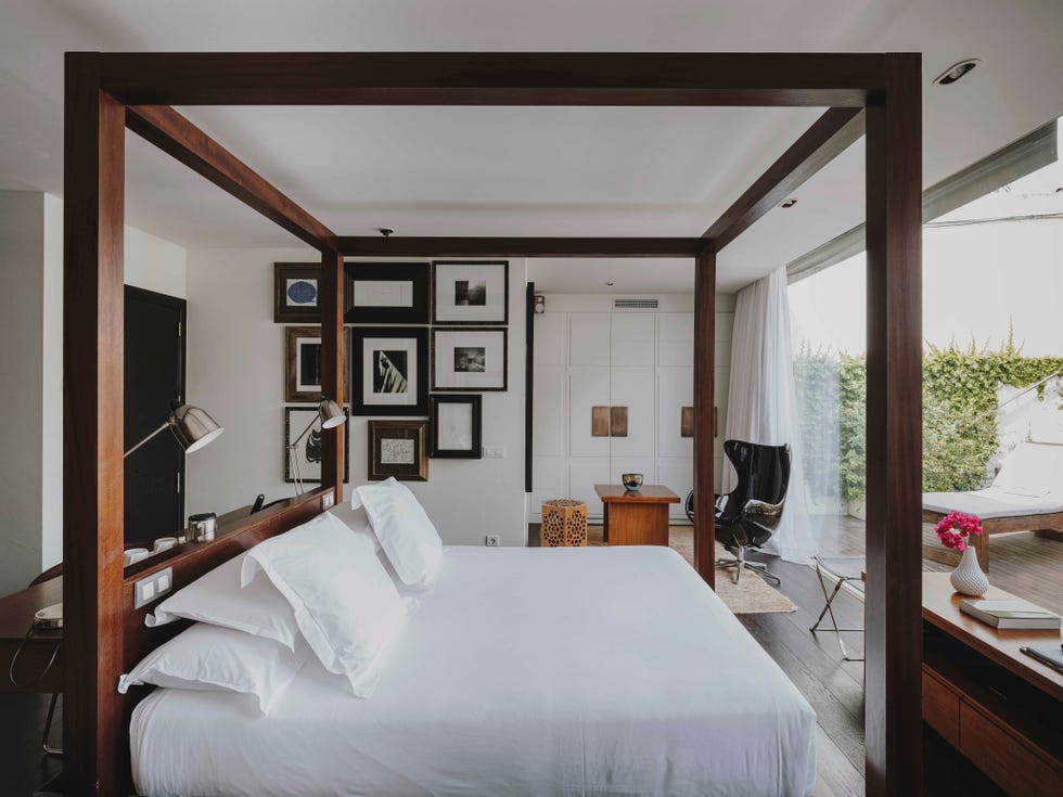a bedroom with a four poster bed