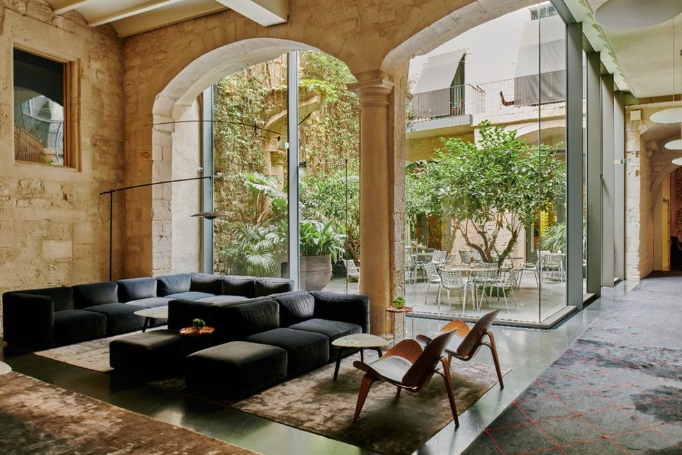 a room with a couch and chairs at mercer barcelona