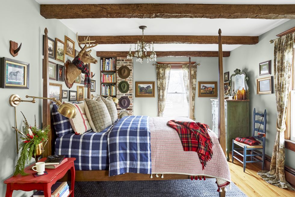 the woodman house, a 216 year old dutch colonial farmhouse in the tiny catskills hamlet of hortonville, new york homeowners shawn lang and kristofer prepelica bedroom, plaid bedding, blue bedroom