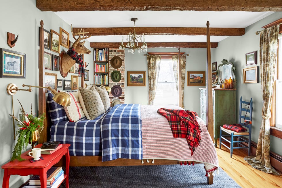 the woodman house, a 216 year old dutch colonial farmhouse in the tiny catskills hamlet of hortonville, new york homeowners shawn lang and kristofer prepelica bedroom, plaid bedding, blue bedroom