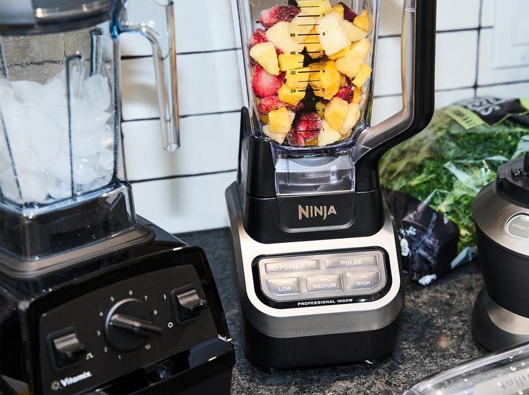 best tested ninja vitamix and nutribullet blenders with frozen fruit ice and kale on counter
