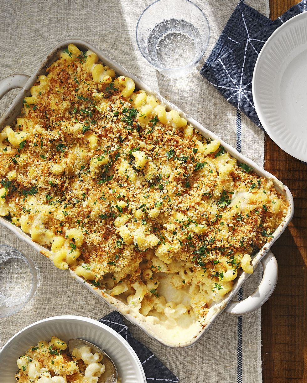 cauliflower mac and cheese in a white rectangle baking dish