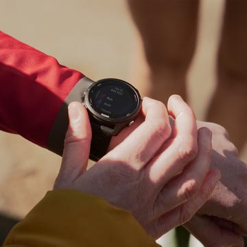 a person getting ready to log a run on their running watch a person getting ready to log a run on their running watch