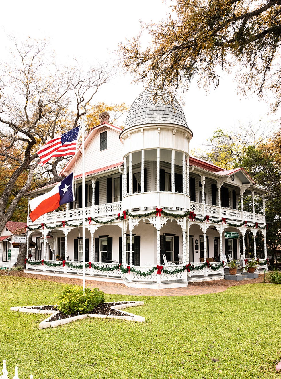 a white house with flags