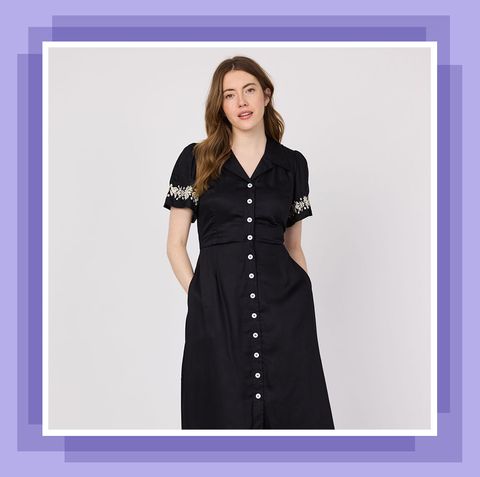 woman in black buttoned down dress with pockets