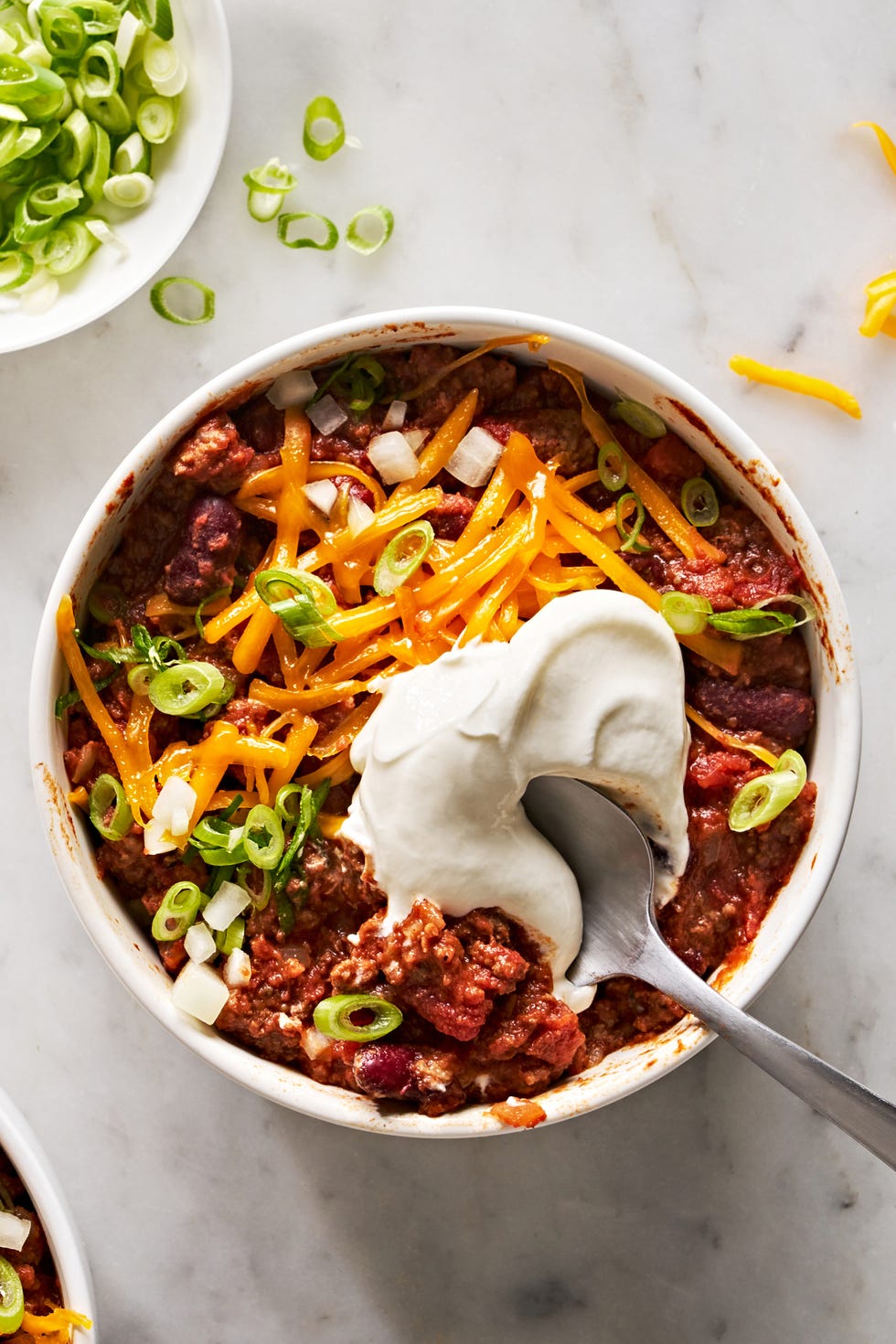 classic beef chili with sour cream and toppings