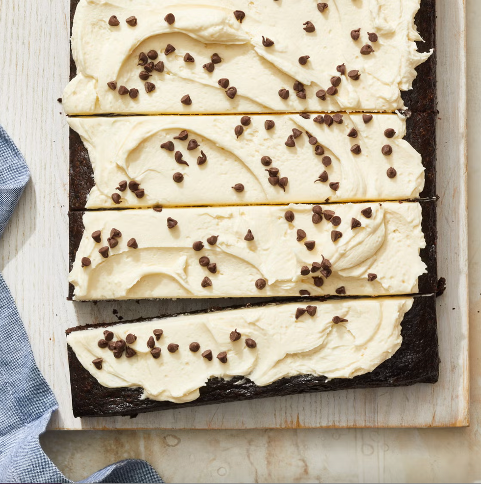 chocolate cake with frosting and mini chocolate chips on top