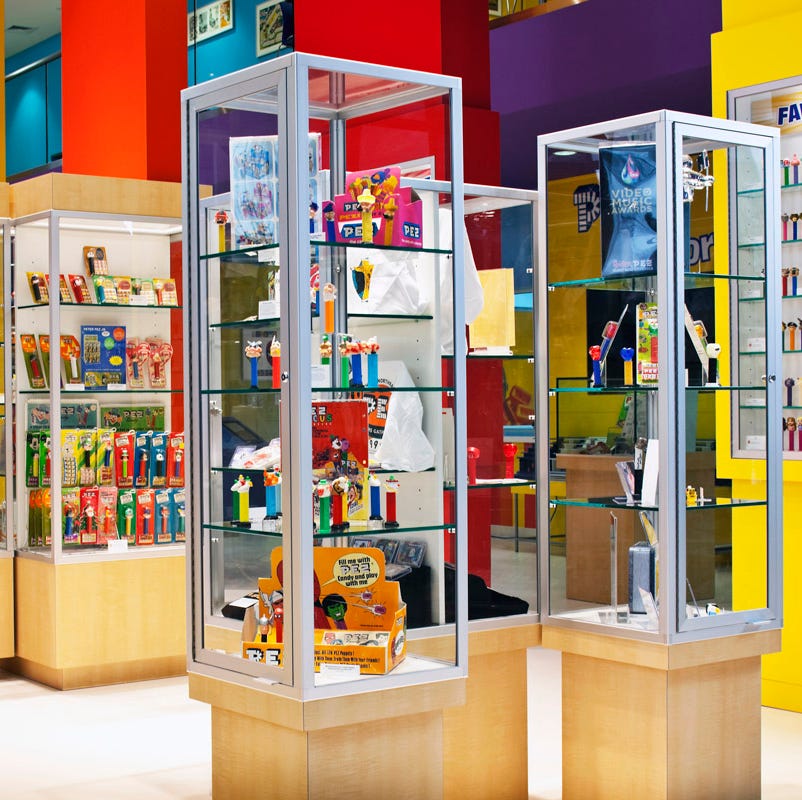 glass cases filled with dispensers in the pez factory, a good housekeeping pick for best factory tours