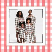 families wearing matching pajamas with a red gingham border