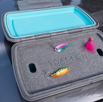 a car with a plastic lid and a plastic container with a couple of colorful objects in it