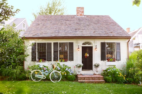 home of steve ballerini and colin bohrer, one of the oldest cape cottages in provincetown, massachusetts cape cod cottage, cape cod style home exterior, black front door