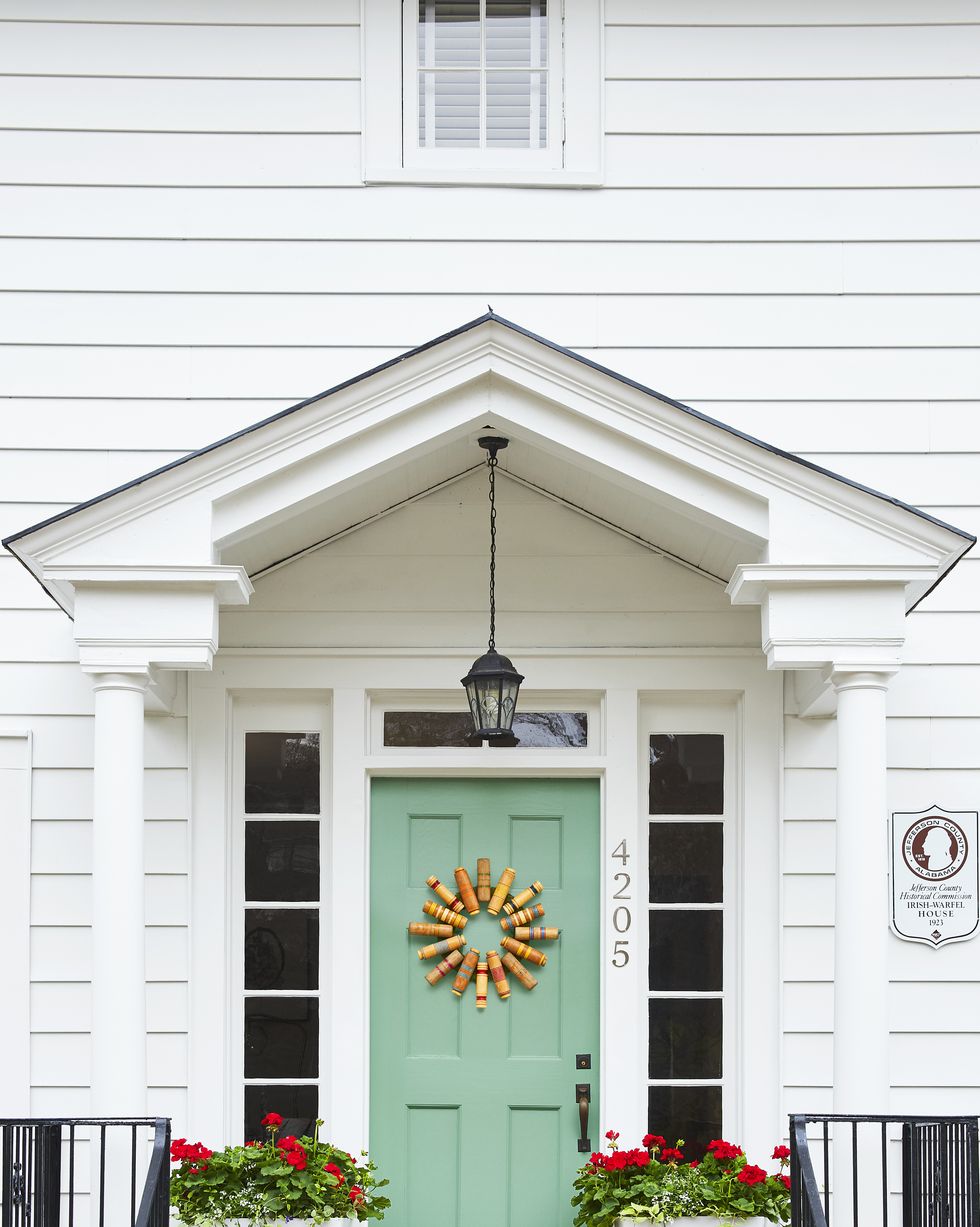 croquet set door wreath, white house with green front door