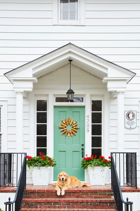 croquet set door wreath, white house with green front door