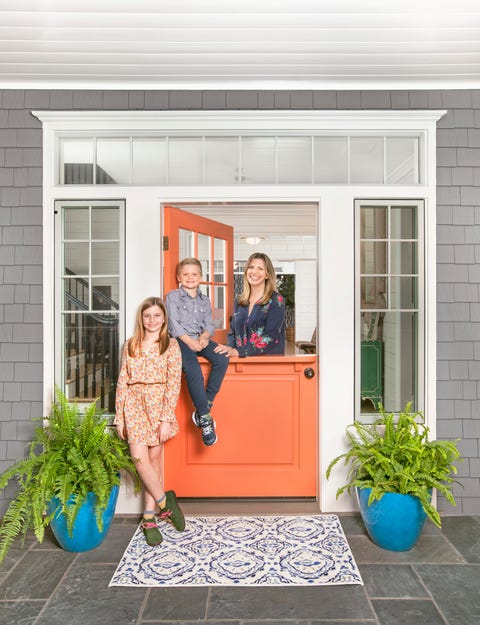 gray house with pomegranate orange door