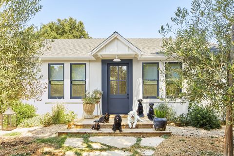 home of jen curtis, a 1927 cottage in los alamos on california’s central coast exterior front door color deep space by benjamin moore