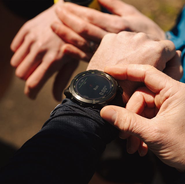 a person playing with their smartwatch a person playing with their smartwatch