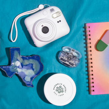 stanley cup, instant camera, state spoon rest, earbuds, magnolia bakery, planner and highlighters