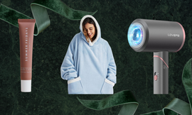 product arrangement featuring lip balm a cozy blue hoodie and a hair dryer