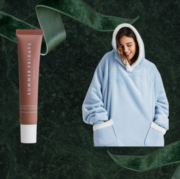 product arrangement featuring lip balm a cozy blue hoodie and a hair dryer product arrangement featuring lip balm a cozy blue hoodie and a hair dryer