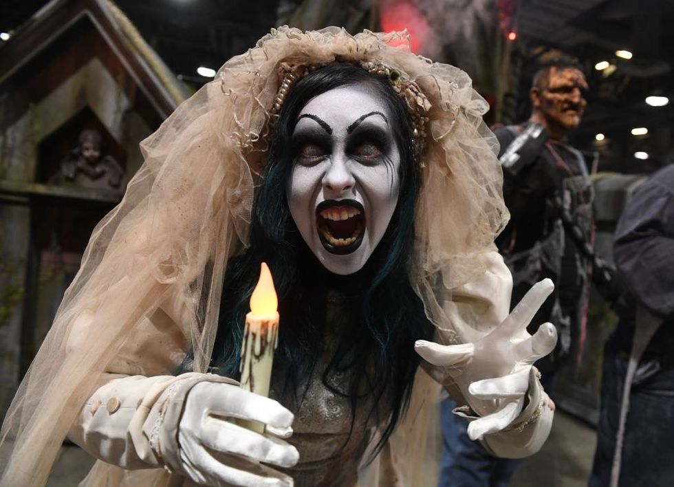 an actor from knotts scary farm halloween festival poses at the annual midsummer scream horror convention in long beach, california