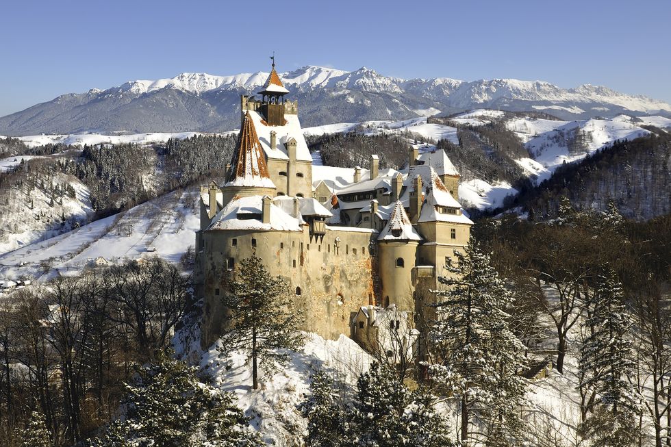 bran castle in winter with snow and bucegi mountainsmore pictures with dracula's bran castle in my portfolio