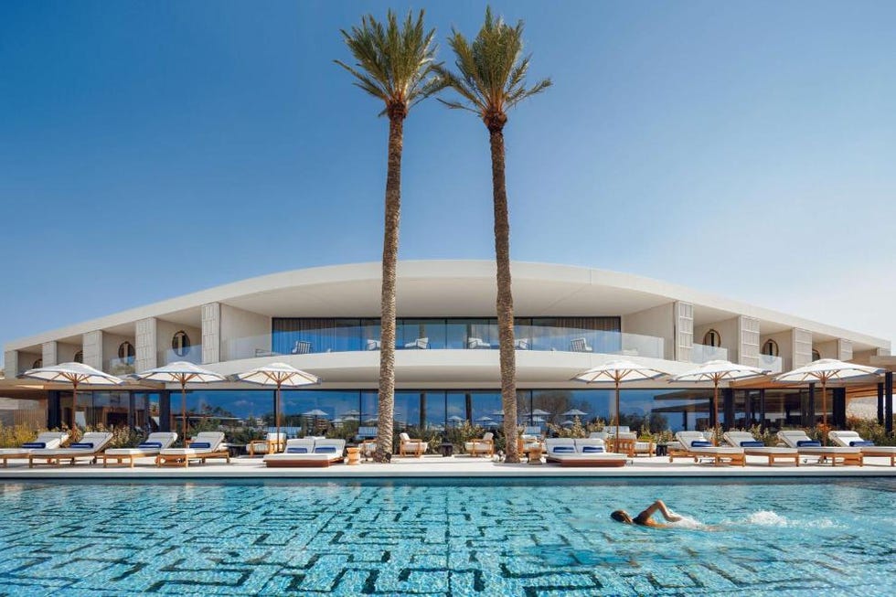 a pool with a building in the background