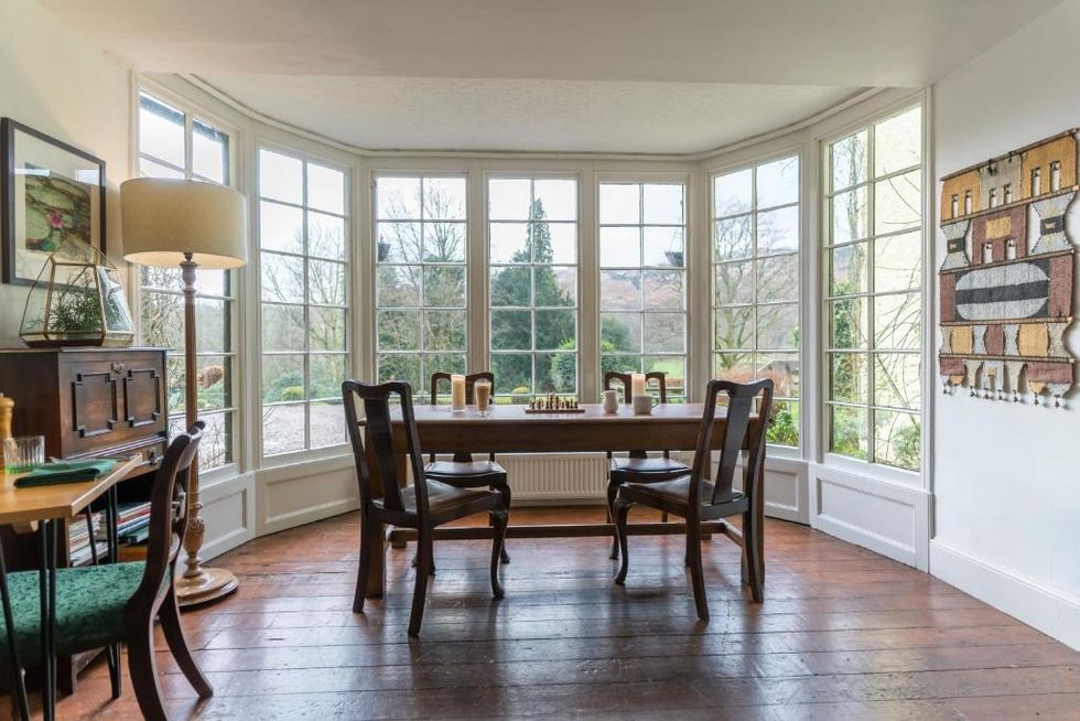a dining room with a large window