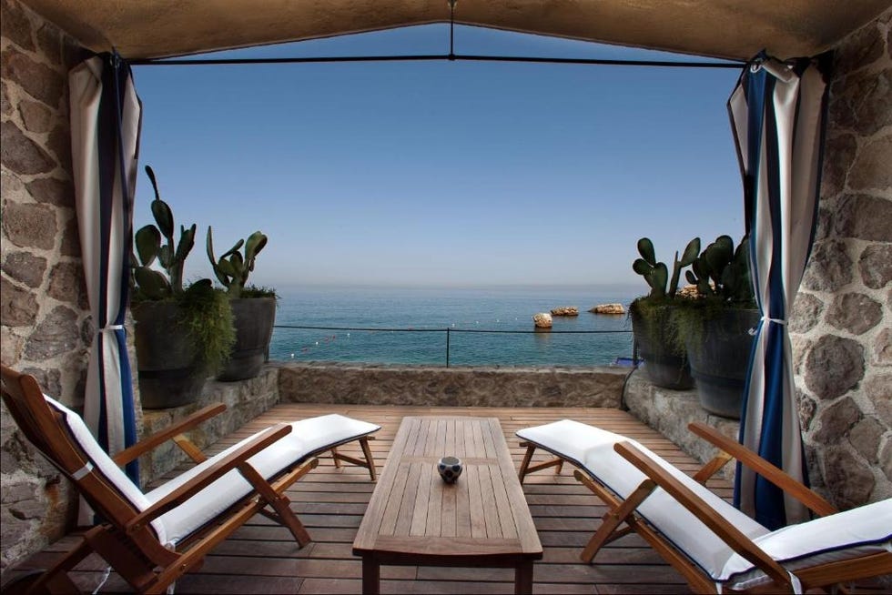 a table and chairs on a deck