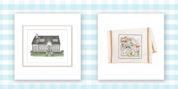 framed photo of a custom house, and a state tea towel on a blue and white gingham background