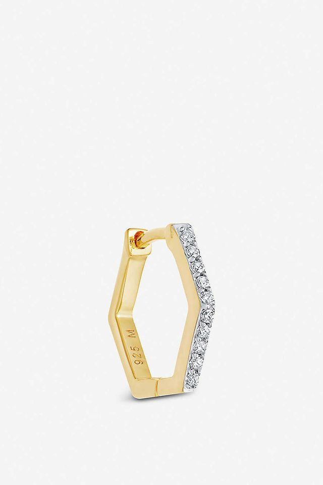 a hexagonal gold huggie earring with diamonds