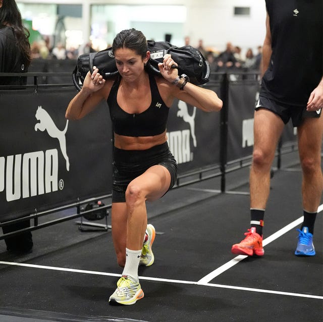 a woman competing in a fitness competition including lunges and a sled push a woman competing in a fitness competition including lunges and a sled push