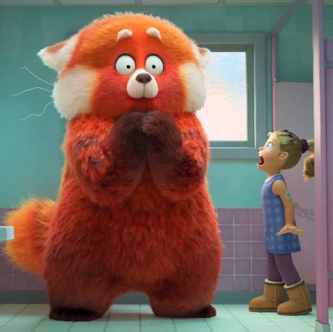 a girl gawks at a giant red panda in turning red, a good housekeeping pick for best kids movies 2022