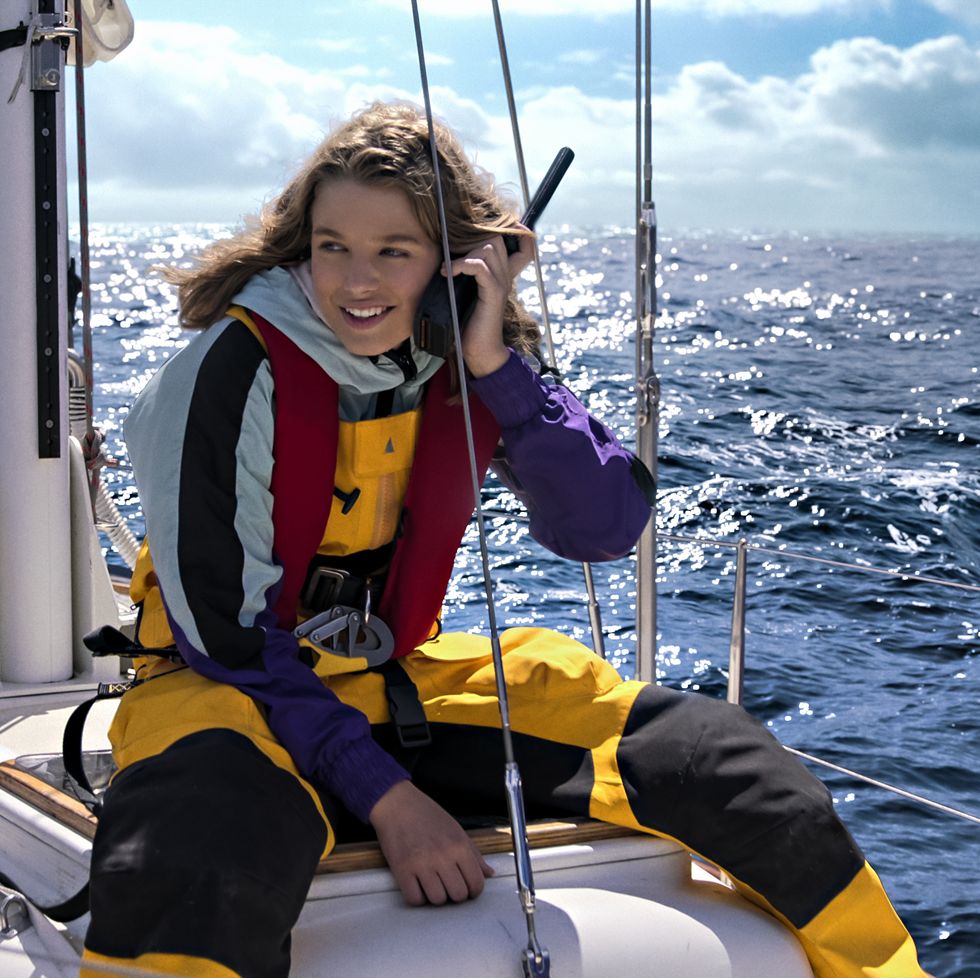 jessica watson makes a call from a boat in a scene from true spirit, a good housekeeping pick for best kids movies 2023